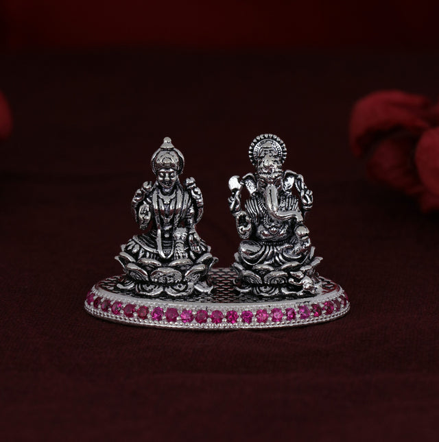 Shri Ganesh Laxmiji Micro Silver Murti Collection adorned with exquisite pink stones.