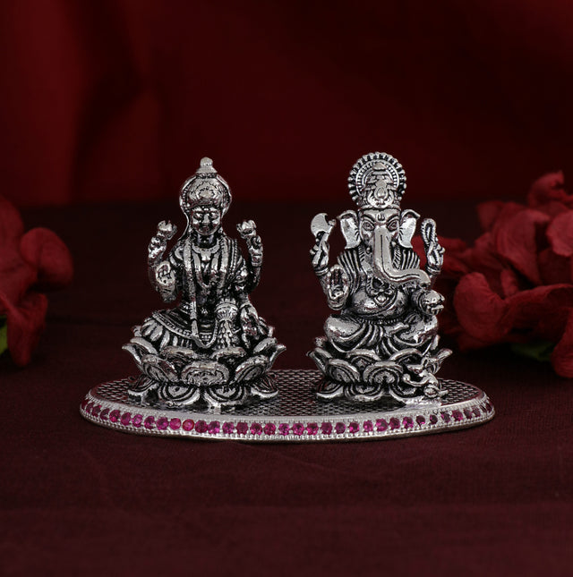 Shri Ganesh Laxmiji Silver Murti adorned with delicate pink stones