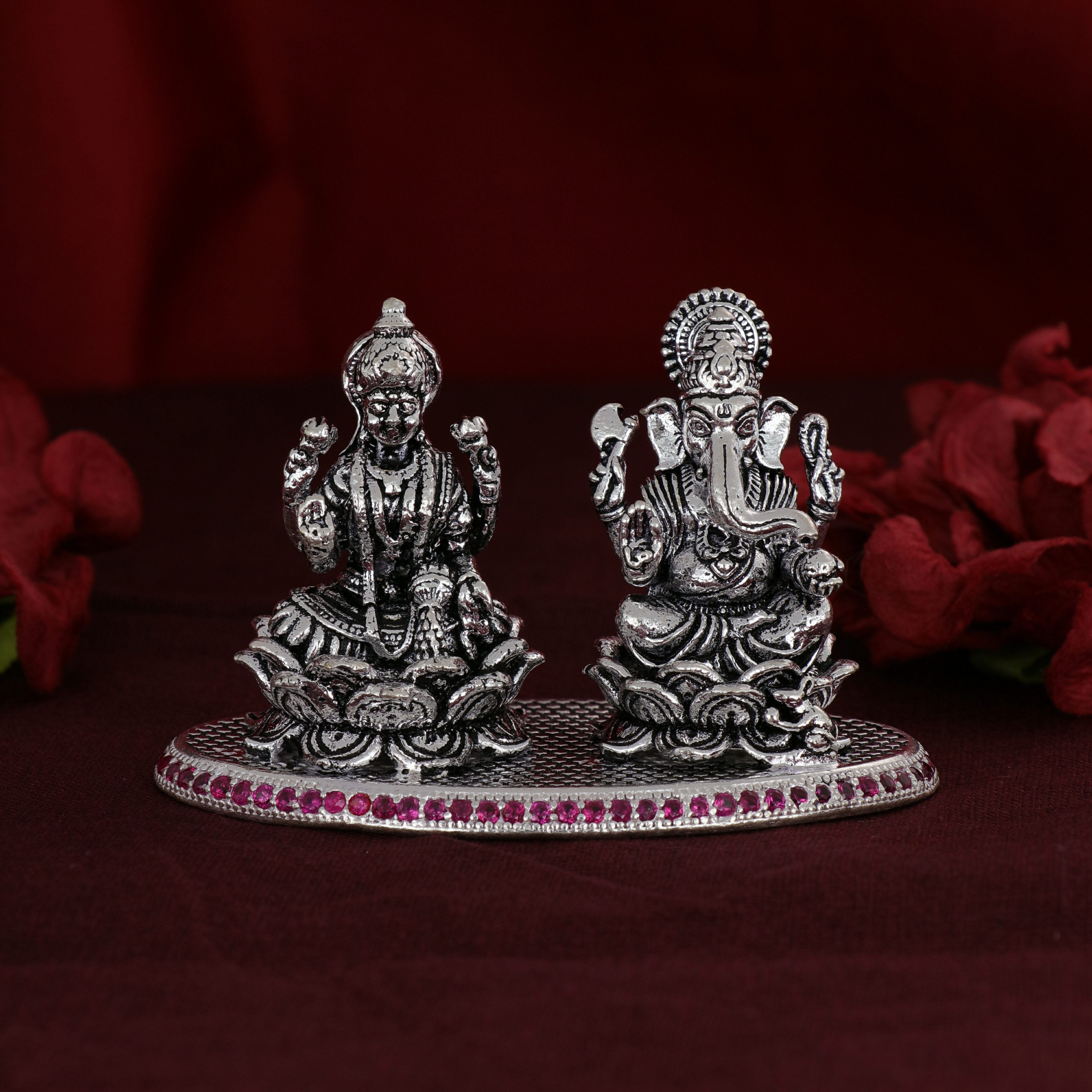Shri Ganesh Laxmiji Silver Murti adorned with delicate pink stones